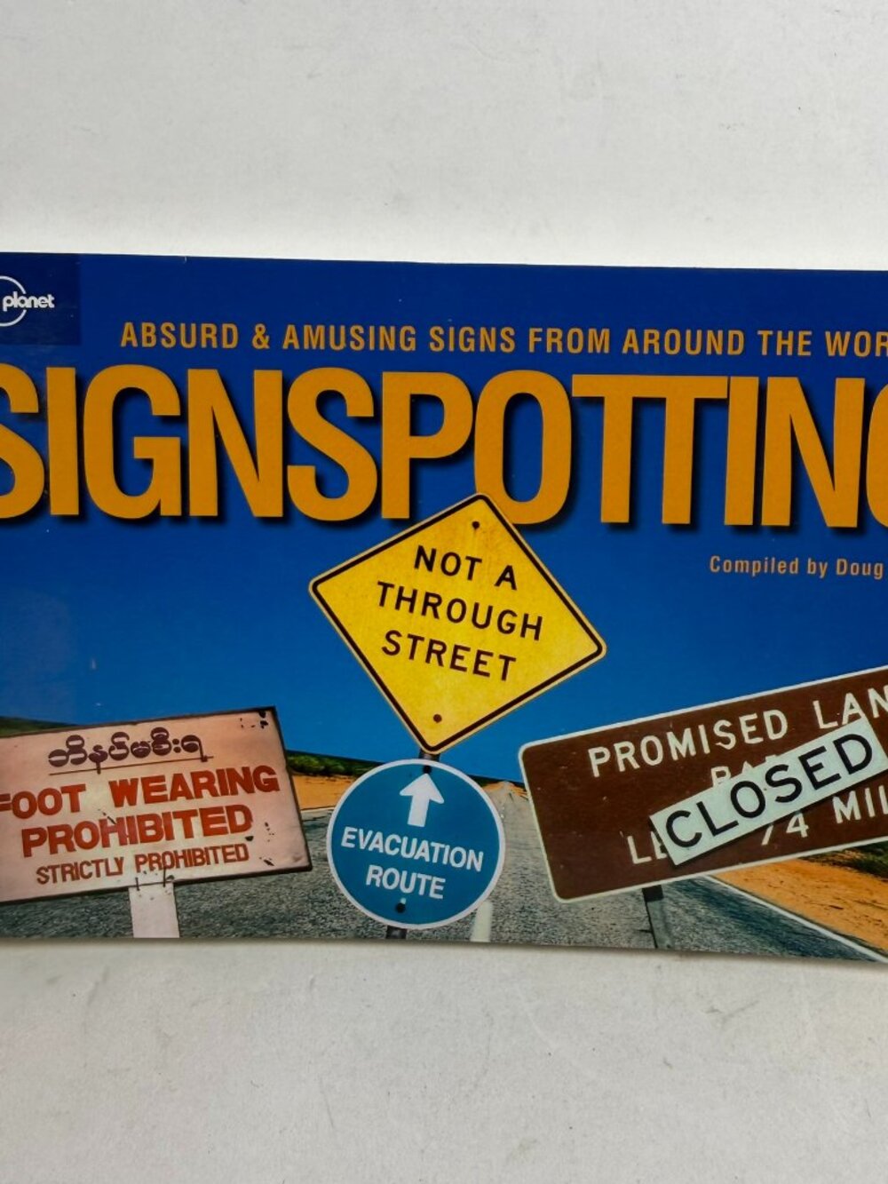 Signspotting Absurd & Amusing Signs Doug Lansky Lonely Planet Travel Humor Book